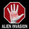 Open hand with the text stop alien invasion