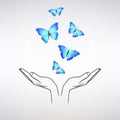Open Hands Release a Flock of Blue Butterflies