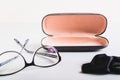 Open hard case for storage, glasses and cleaning cloth nearby on the table Royalty Free Stock Photo