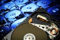 Open hard disk drive of computer, with postproduction effects. Royalty Free Stock Photo