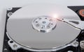 Open hard drive with magnetic disk and writing head Royalty Free Stock Photo