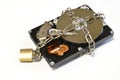 Open hard drive secured with an iron chain and padlock. Royalty Free Stock Photo