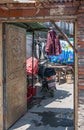 Open heavy door with panda image in Hutong dowtown Tongli, China