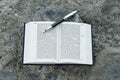 Open Hebrew Bible - TANAKH Torah, Neviim, Ketuvim - The Law, The Prophets, The Writings with fountain pen outdoors.