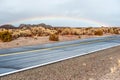 Open highway and rainbow Royalty Free Stock Photo