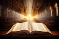 Open holy bible book with glowing lights in church