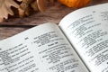 Open holy bible book, psalm 100 verse for thanksgiving and praise to God Jesus Christ on wooden table