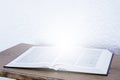 Open holy bible book on the table. Light from the book. Scripture Royalty Free Stock Photo