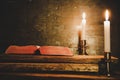 Open Holy Bible and candle on a old oak wooden table. Beautiful gold background. Royalty Free Stock Photo