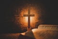 Open Holy Bible and candle on a old oak wooden table. Beautiful gold background. Royalty Free Stock Photo