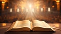 Open Holy Bible with glowing lights in a church Royalty Free Stock Photo