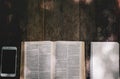 Open holy bible on wood table with sunlight.Sunday reading