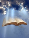 Open holy bible word of god sun rays beam clouds Royalty Free Stock Photo