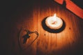 Open Holy and candle on a old oak wooden table. Beautiful gold background. Royalty Free Stock Photo