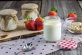 Homemade white yoghurt ripening in the glass jar