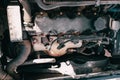 Open hood of the car. View of the engine and vehicle parts. Diagnostics and repair of old car. Royalty Free Stock Photo