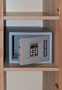 Open hotel safe on shelf Royalty Free Stock Photo