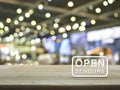 Open 24 hours icon on wooden table over blur light and shadow of Royalty Free Stock Photo