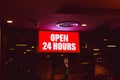 Open 24 hours sign banner in shop