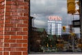 Shop with open hours sign on window in downtown of Ottawa, Canada