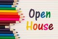 Open house message with color pencils on vintage ruled line notebook paper