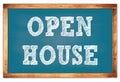 OPEN HOUSE words on blue wooden frame school blackboard Royalty Free Stock Photo