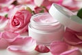 Open Jar of Luxurious Rose-Scented Cream Surrounded by Fresh Pink Petals Royalty Free Stock Photo