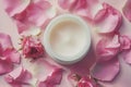 Open Jar of Luxurious Rose-Scented Cream Surrounded by Fresh Pink Petals Royalty Free Stock Photo