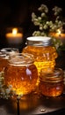 Open jars honey are on wooden table. Rustic still life in warm colors in cozy kitchen