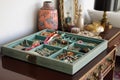 open jewelry box filled with colorful and eclectic pieces