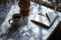 an open journal and a cup of coffee sit on a marble table Royalty Free Stock Photo