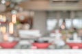 Open kitchen blur background in luxury hotel restaurant facility showing chef cooking over blurry food counter for buffet catering Royalty Free Stock Photo