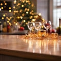 Open kitchen counter top champagne glasses ornaments. Christmas tree decorated with golden garland. Cozy homely festive atmosphere Royalty Free Stock Photo