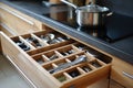 Open kitchen drawer with cutlery Royalty Free Stock Photo