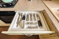 Open kitchen drawer with silverware inside Royalty Free Stock Photo