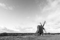 Open landscape with an old windmill in BW Royalty Free Stock Photo