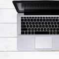 Open laptop with blank screen on a white background top view Royalty Free Stock Photo