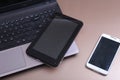 Open laptop with digital tablet and white smartphone Royalty Free Stock Photo