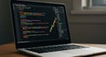 Open laptop displaying code on the screen, featuring syntax highlighting with colorful Royalty Free Stock Photo