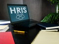 Open laptop with HRIS Human resource management system. Royalty Free Stock Photo