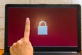 Open laptop with a lock on the screen. hand gesture. concept Royalty Free Stock Photo