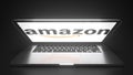Open laptop with logo of AMAZON on the screen. Editorial conceptual 3d rendering