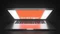 Open laptop with logo of ORANGE on the screen. Editorial conceptual 3d rendering