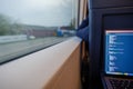 Open laptop or notebook, working as programmer and do some coding on the train during commute. Royalty Free Stock Photo