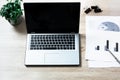 Open laptop on office wooden desk table. Top view, copy space. Royalty Free Stock Photo