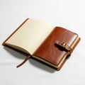 An open, leather-bound notebook with lined pages on a white surface Royalty Free Stock Photo