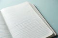 Open lined notebook with blank pages. Blank paper surface with blue horizontal lines. Ready for notes, writing, or sketching. Royalty Free Stock Photo