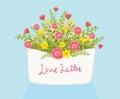 Open love letter with flowers inside over envelope