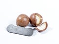 Open Macadamia nut by tool on background Royalty Free Stock Photo