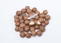 Open Macadamia nut by tool on background Royalty Free Stock Photo